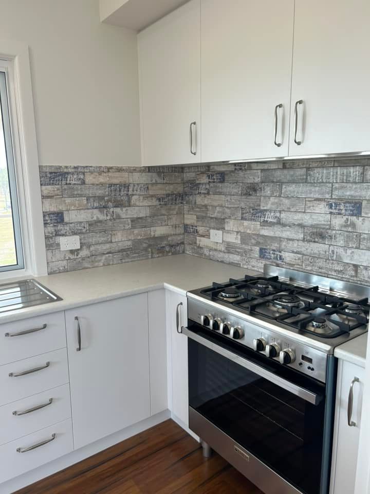 Classic Queensland Homes Showcases a Kitchen Adorned With Elegant White Cabinets — Builder In Gympie, QLD