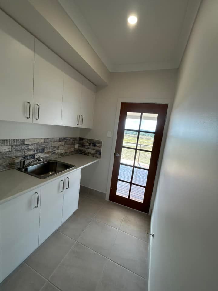 Charming Kitchen Featuring Pristine White Cabinets — Builder In Gympie, QLD