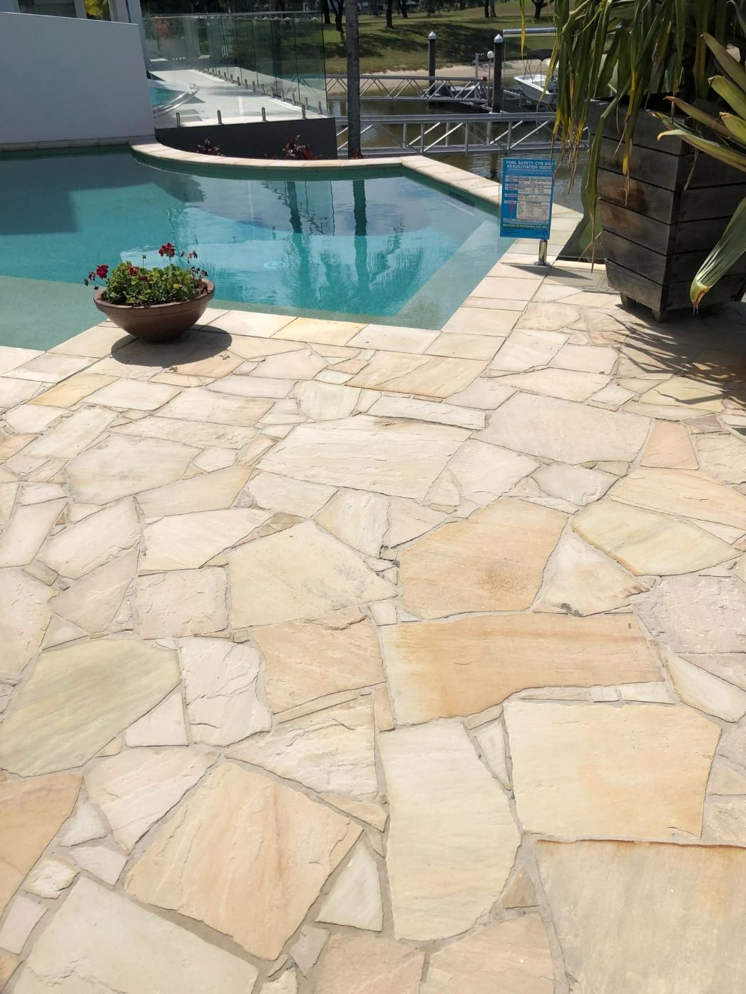 A Man is Cleaning the Roof of a House With a Vacuum Cleaner — Hard Surface Cleaners in Sydney, NSW