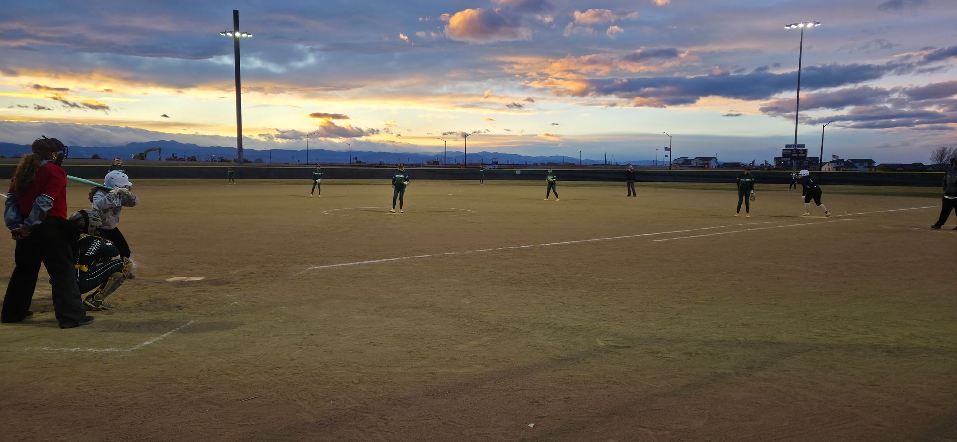Baseball on a dark surface, with visible stitching.