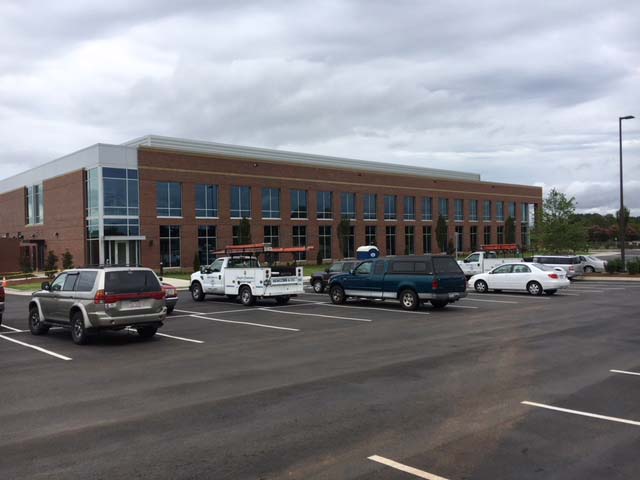 Building With Cars In The Garage Outside — Goldsboro, NC — Ernest Glass Co. Inc.