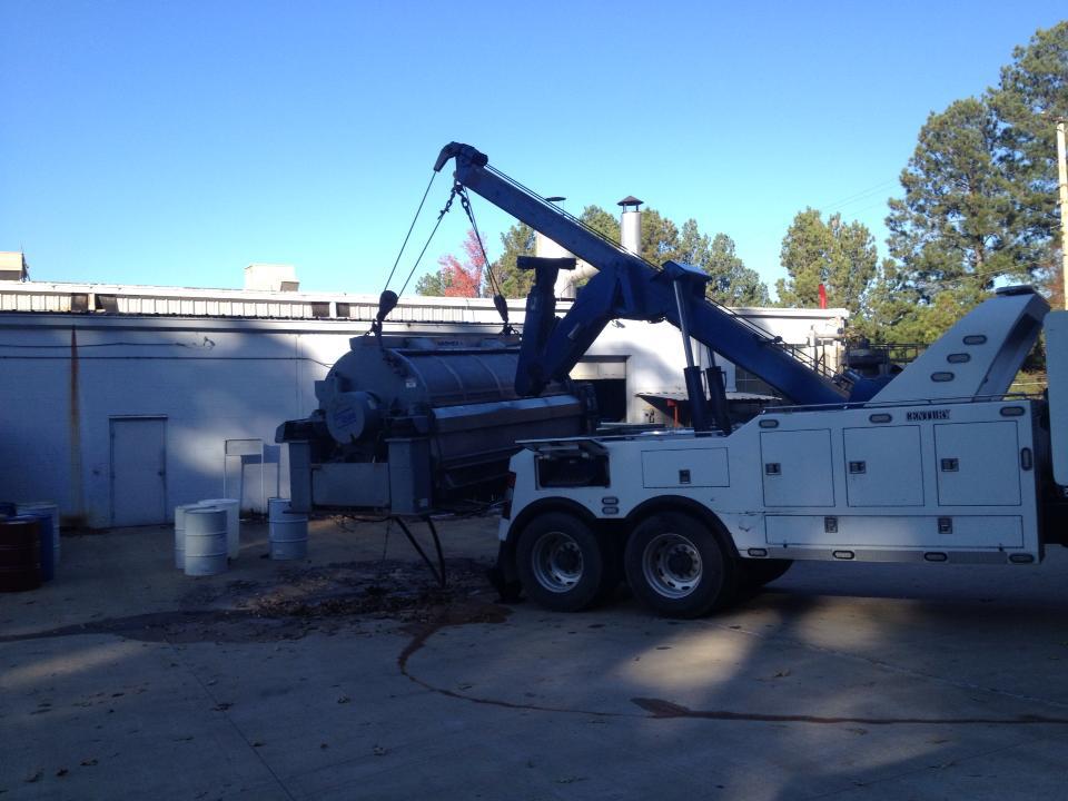 Commercial Washing Machine Lifted To Set Onto A Flatbed Trailer — Insley’s Towing and Recovery — Pine Bluff, AR