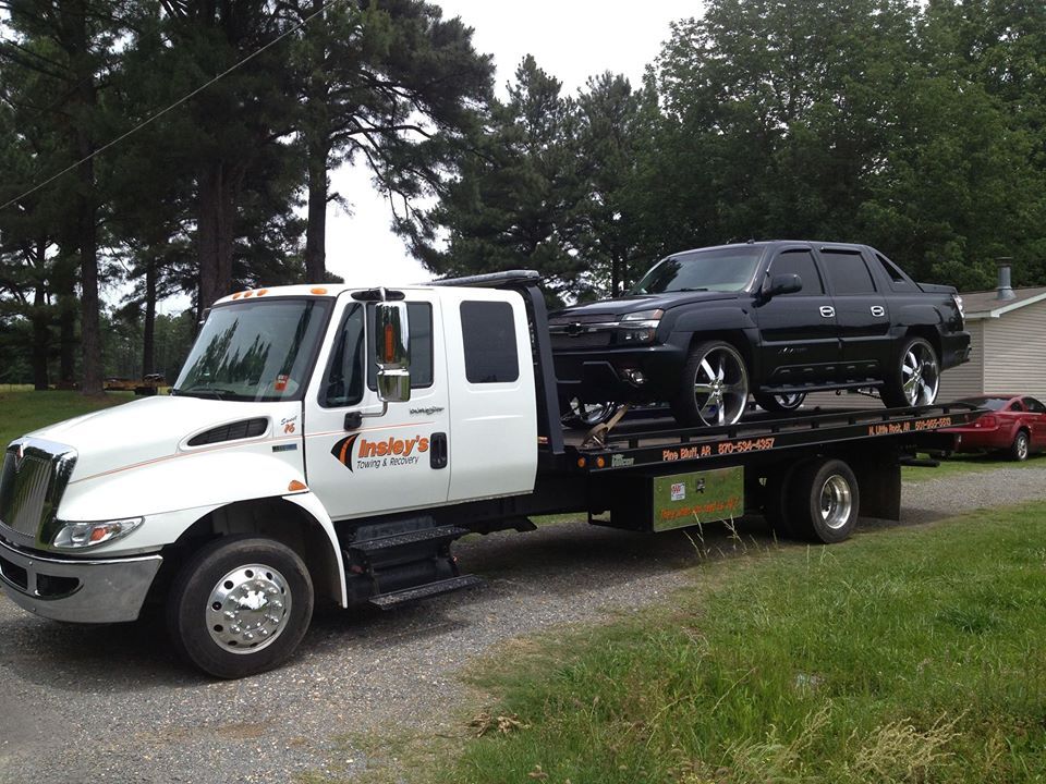 White Flatbed Tow Trucks With Car — Insley’s Towing and Recovery — Pine Bluff, AR