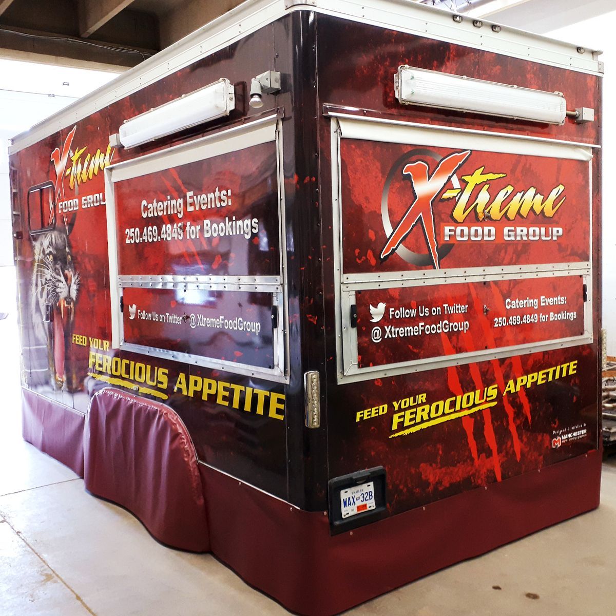 Food truck with red and gold branding, 