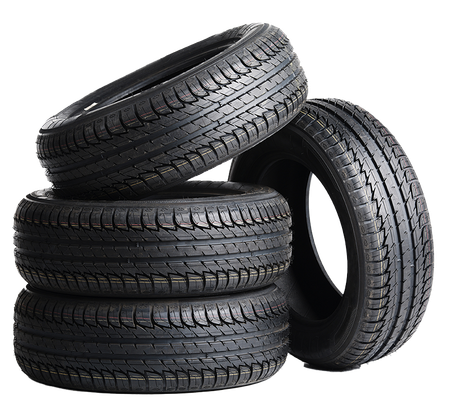 Four tires are stacked on top of each other on a white background
