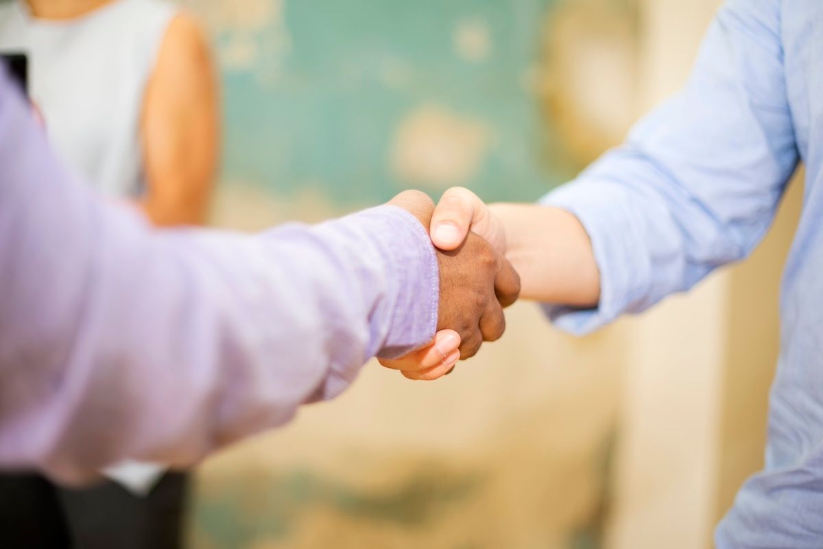 Handshake Between Landlord & Commercial Renter. Rent an Office, Store, or Restaurant in Columbia, MO