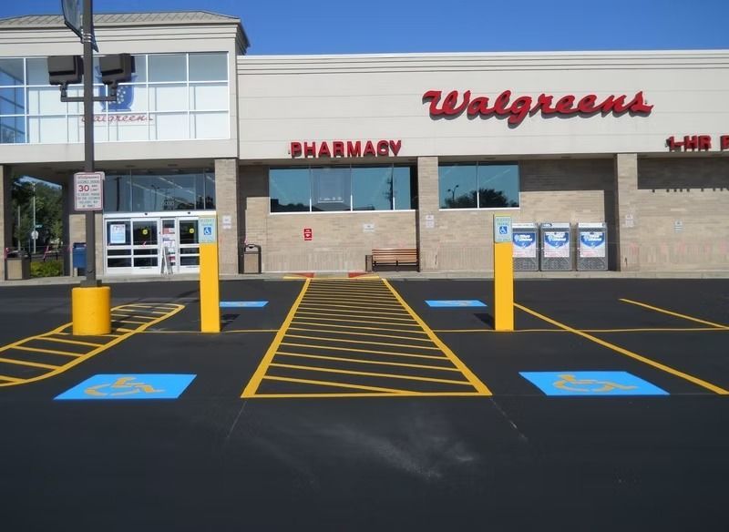 Exterior of a Walgreens with accessible parking spaces marked with blue handicap symbols.