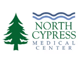 Logo for North Cypress Medical Center featuring a dark green pine tree next to the company name under a blue wavy line.