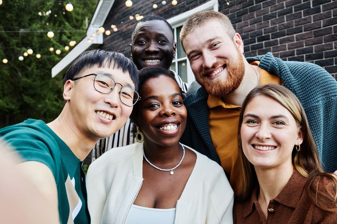 A group of people are posing for a picture together.