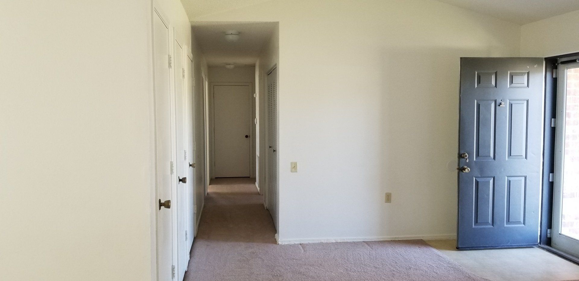 Interior of room looking down hallway