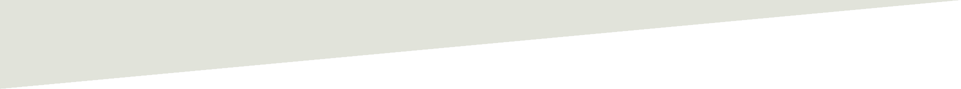 A piece of torn paper is laying on a white surface.