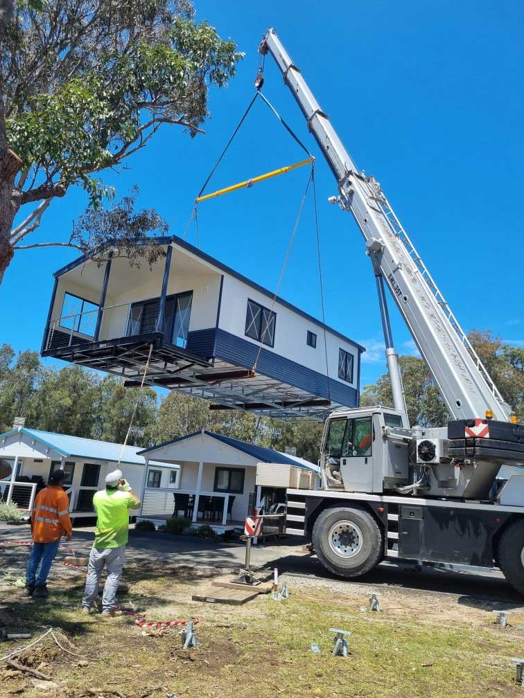 35T Crane Carrying a Mobile Home — We Provide Crane Hire in Shoalhaven , NSW