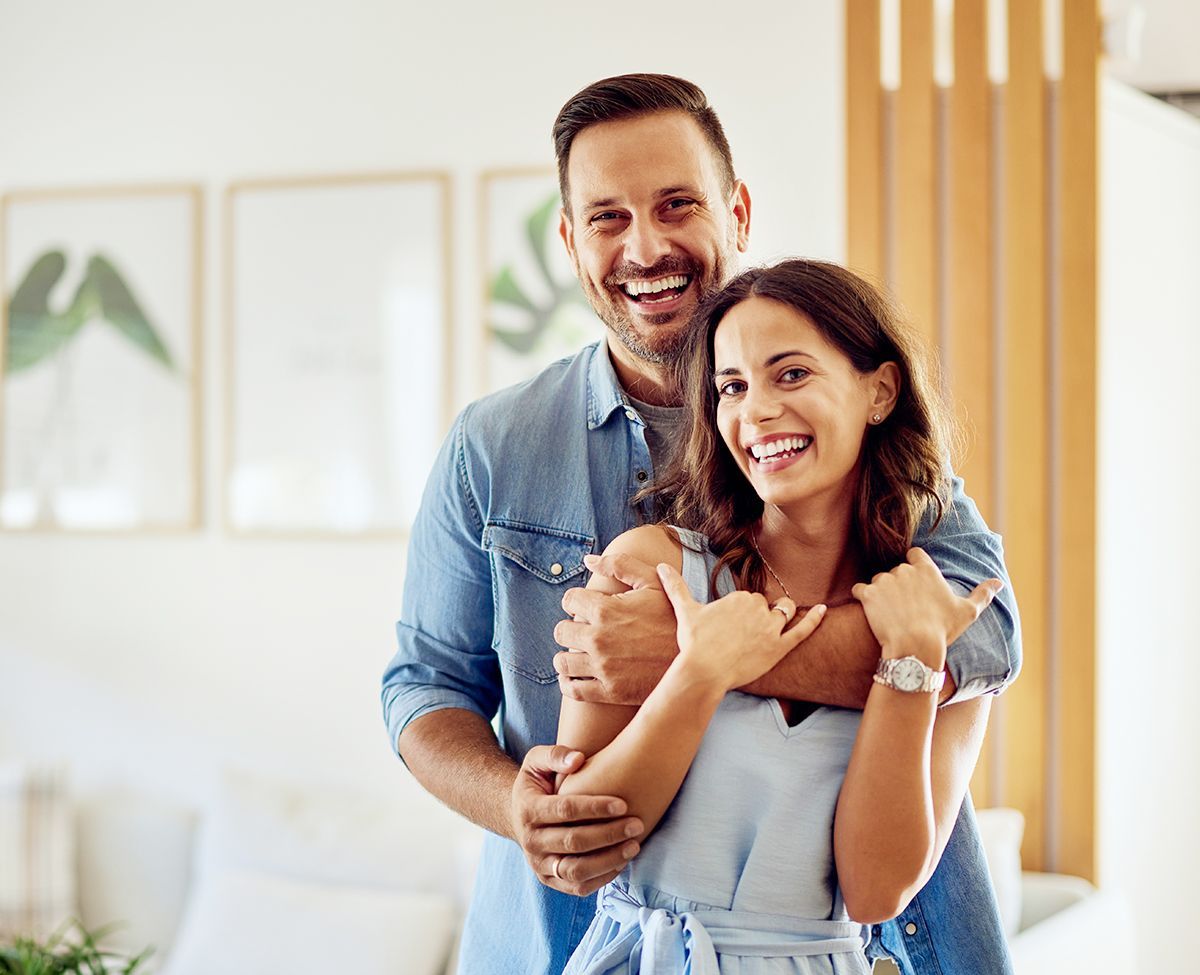 Homeowners celebrating their freshly painted Oshawa home interior