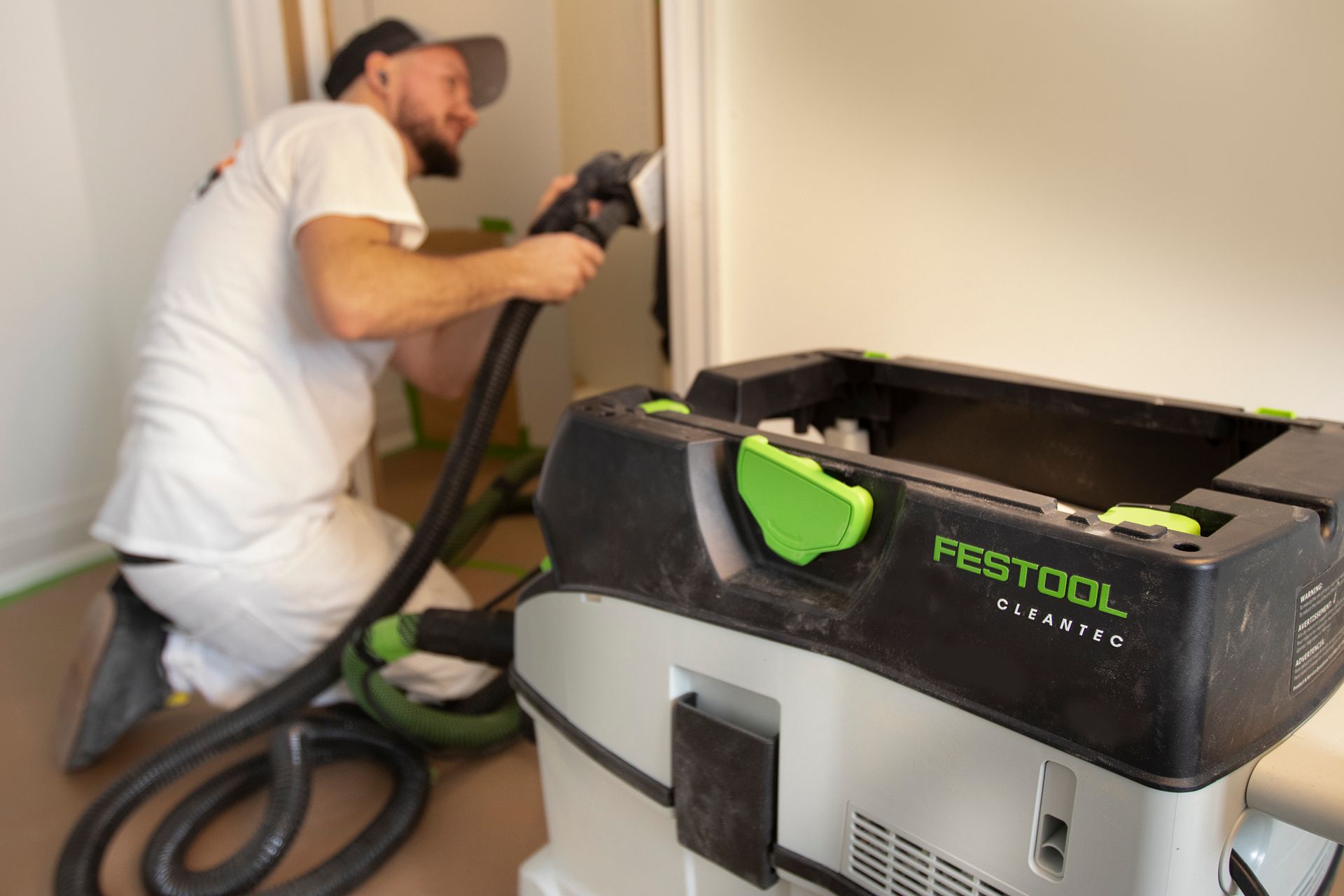 Painter smoothing wood trim for a professional finish