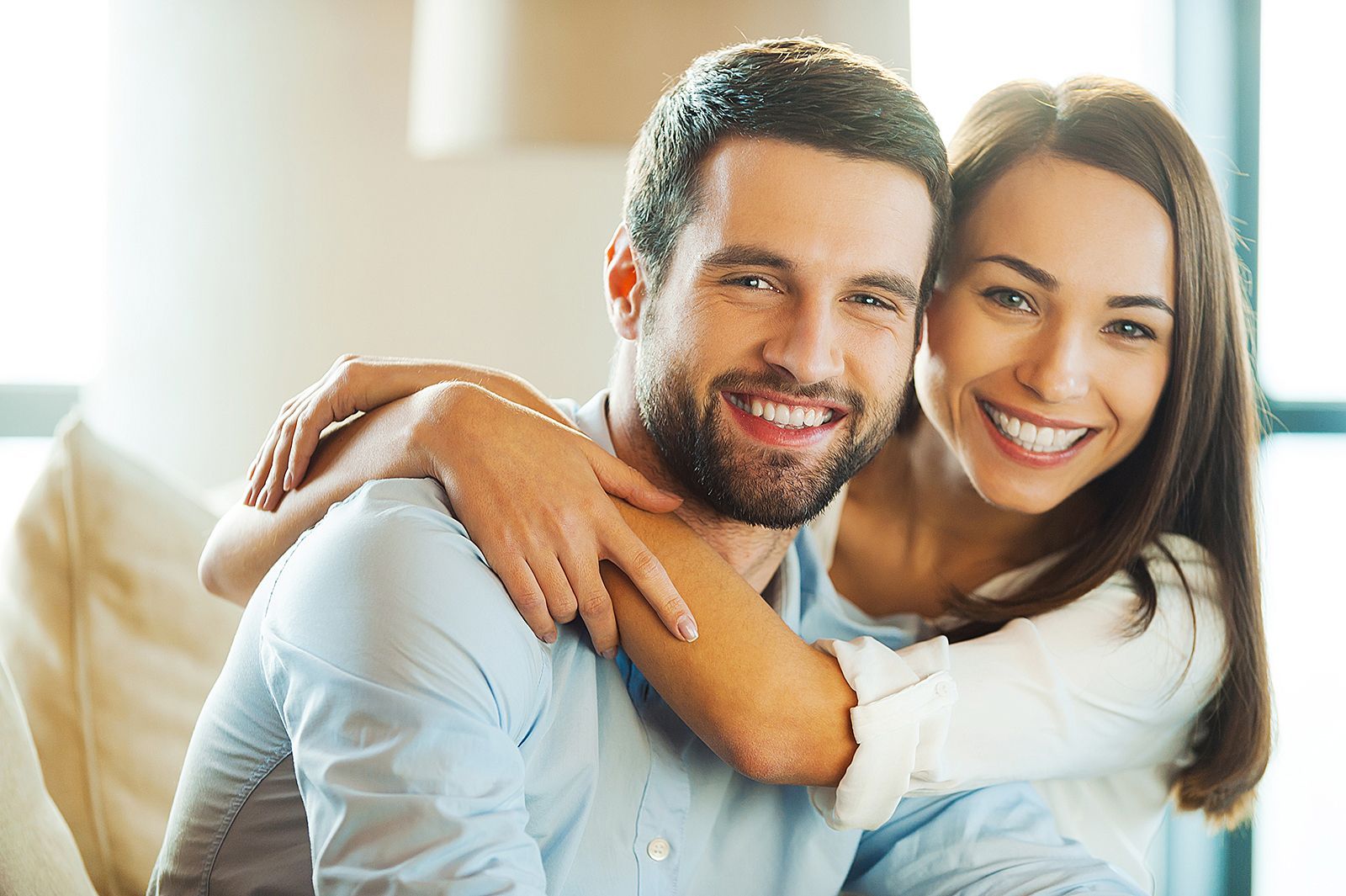Happy couple in Newcastle enjoying a beautifully painted living space