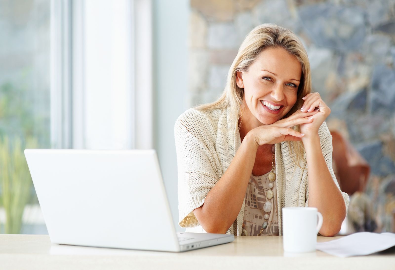 Smiling woman enjoying a bright and refreshed home