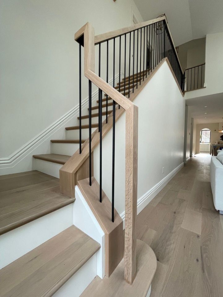 A staircase with wooden steps and a metal railing