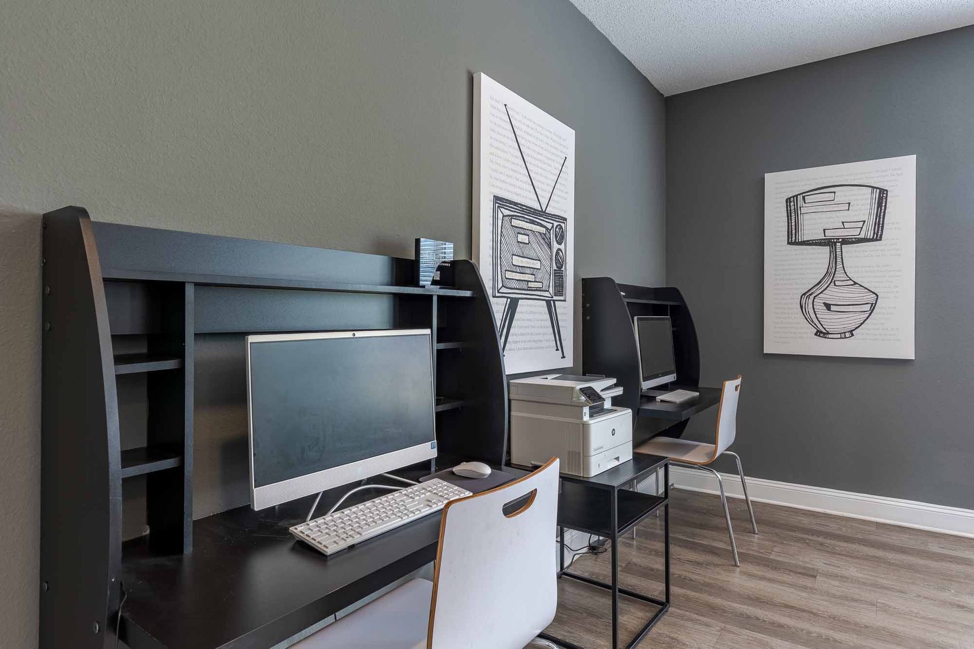 A room with a desk, chairs, and a couch at 51 at Southaven Apartment Homes in Southaven, MS.