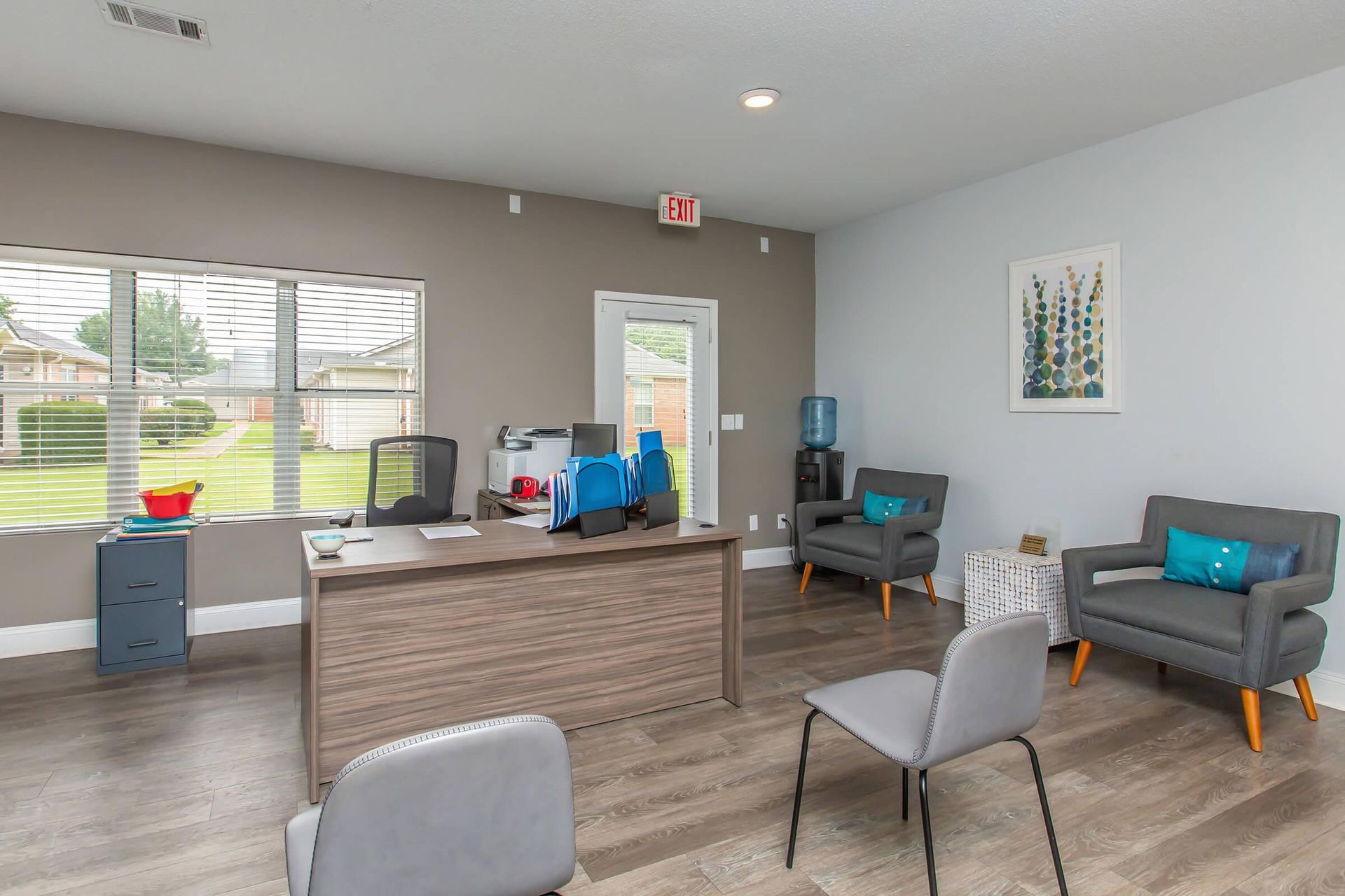 A room with a desk, chairs, and a couch at 51 at Southaven Apartment Homes in Southaven, MS.