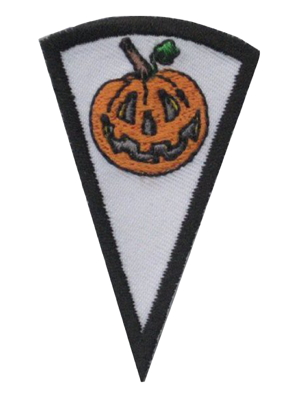 A white triangle with a pumpkin on it award.