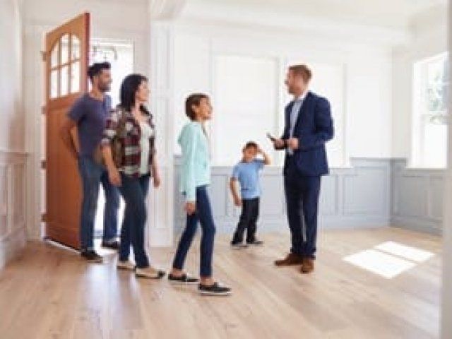 Realtor showing family the house