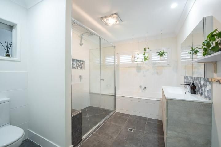 A Bathroom With A Toilet, Sink, Shower And Bathtub — Wares Blinds, Screens & Awnings In Gladstone Central, QLD