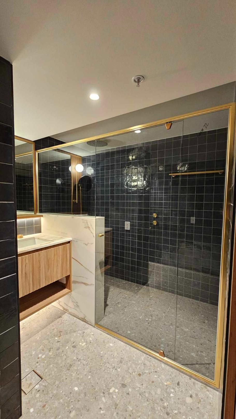 A Bathroom With A Walk In Shower And A Sink — Wares Blinds, Screens & Awnings In Gladstone Central, QLD
