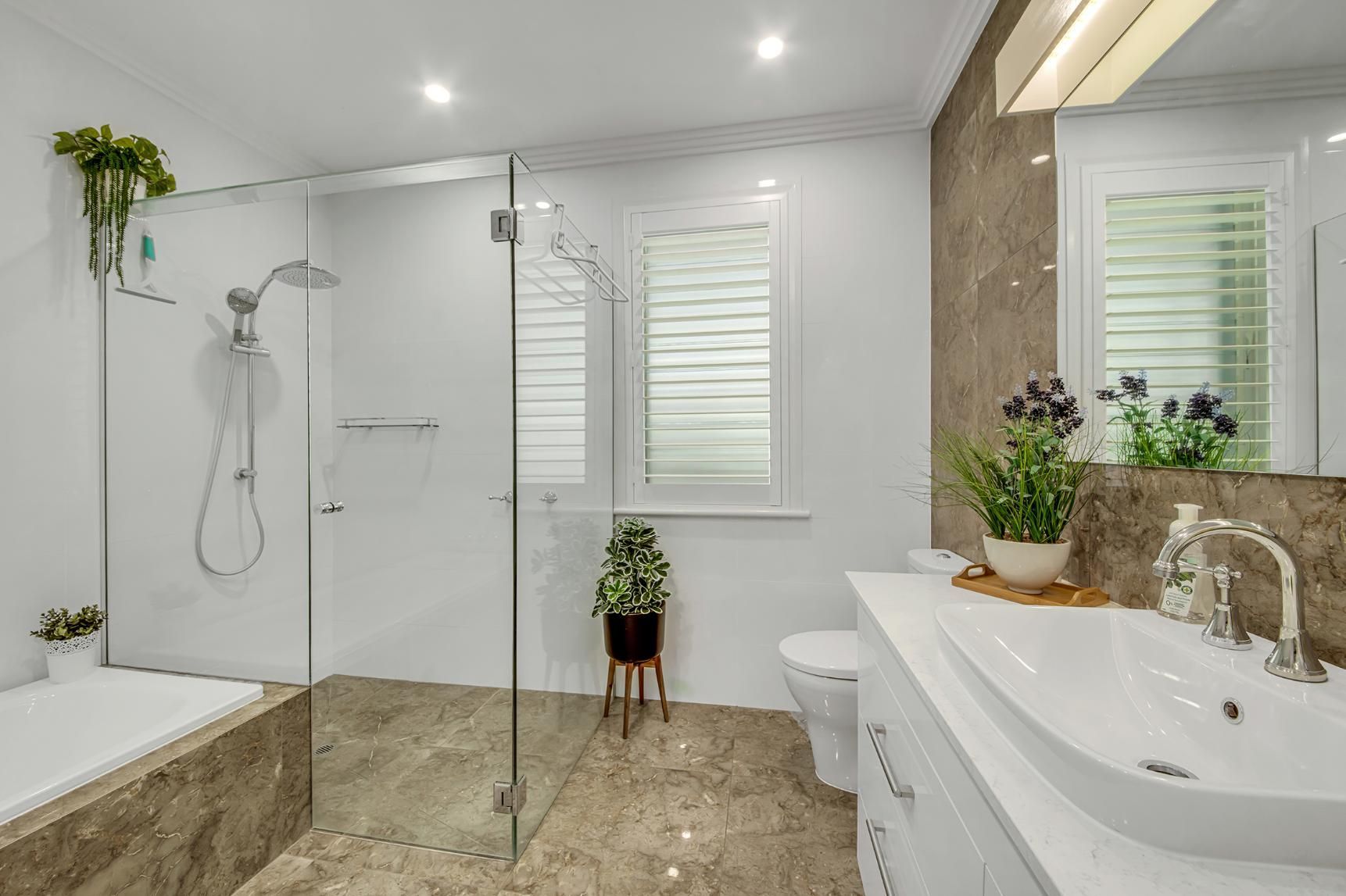 A Bathroom With A Sink , Toilet , Shower And Tub  — Wares Blinds, Screens & Awnings In Gladstone Central, QLD