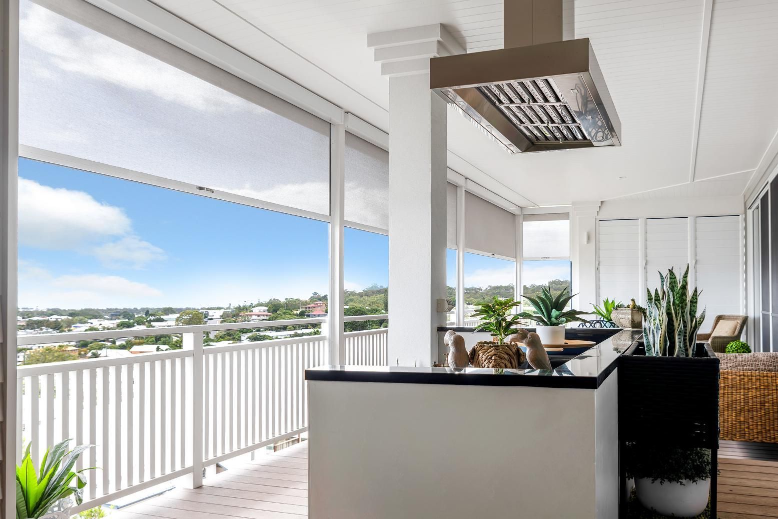 A Kitchen With A Stove Top Oven And A View Of The Ocean  — Wares Blinds, Screens & Awnings In Gladstone Central, QLD