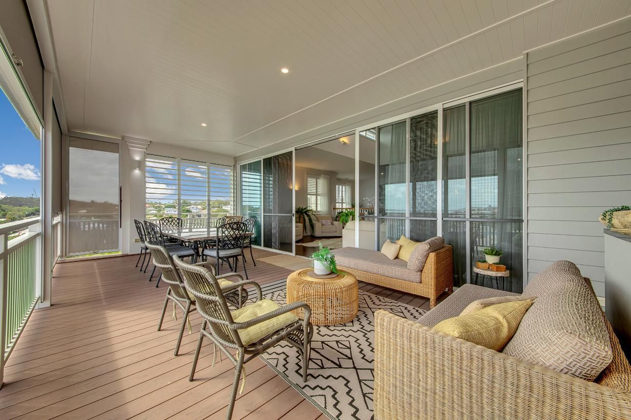 A Couch , Chairs , Table And Sliding Glass Doors  — Wares Blinds, Screens & Awnings In Gladstone Central, QLD