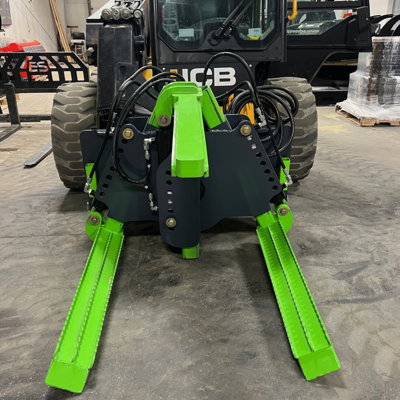 ECHO X3I industrial skid steer tire handler left side view showing heavy duty arms, reinforced frame, and tire gripping
