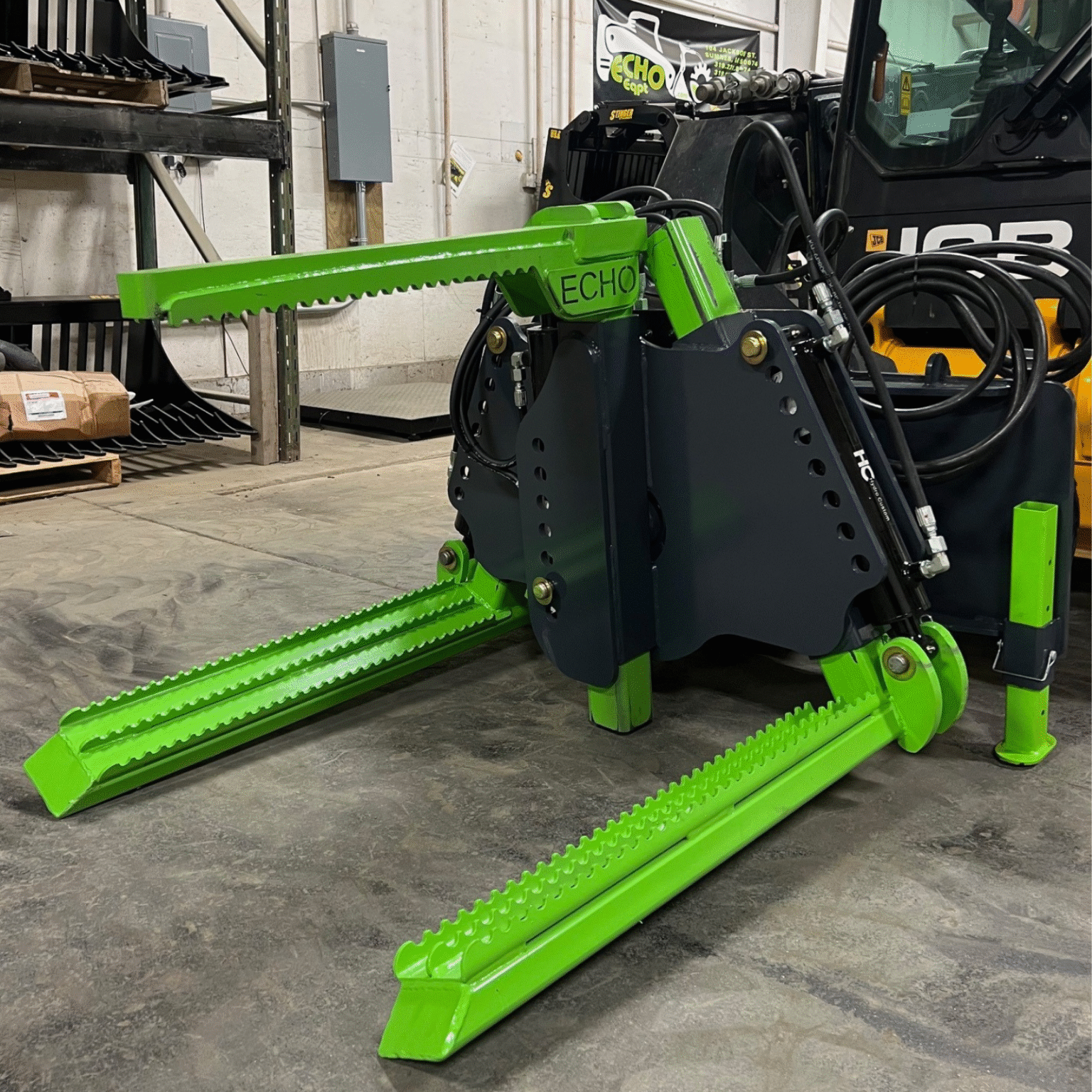 ECHO X3I industrial skid steer tire handler left side view showing heavy duty arms, reinforced frame, and tire gripping