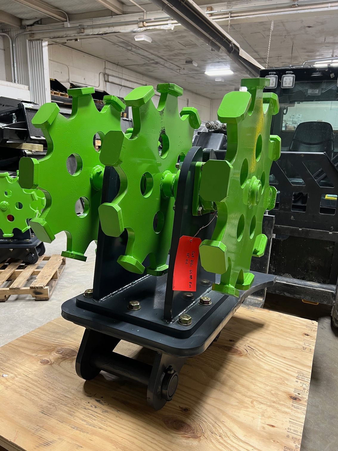 Heavy duty skid steer compaction wheel with spiked drum for trench backfill and soil compaction