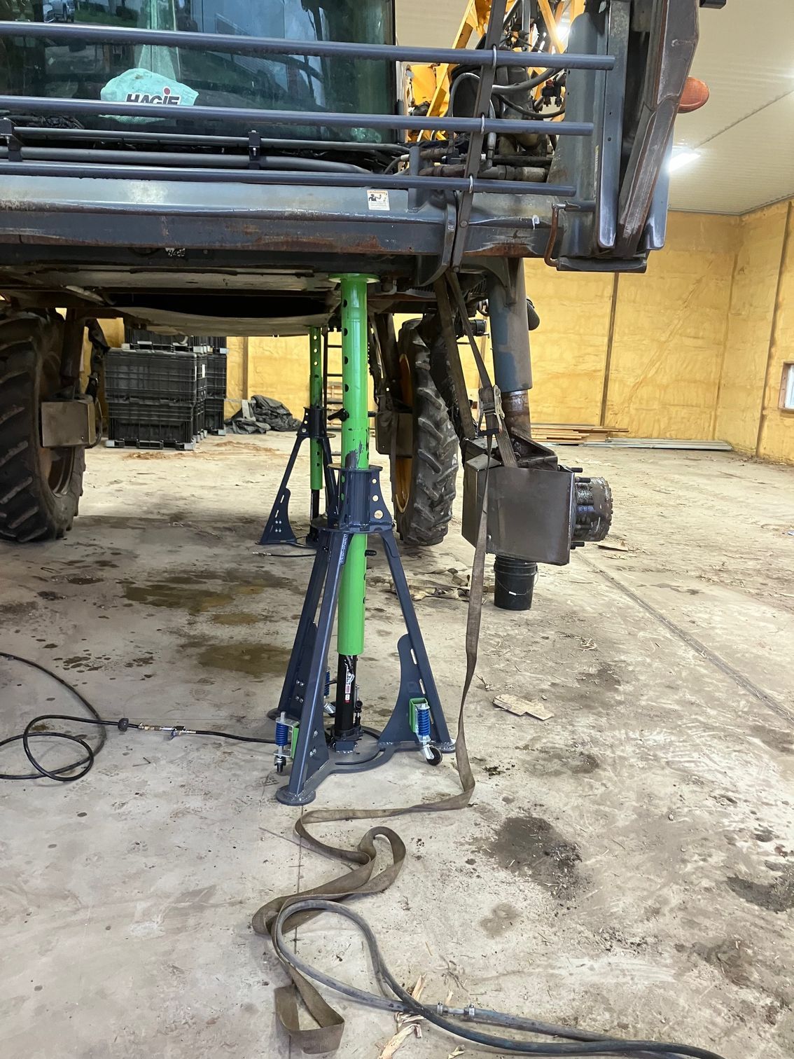 ECHO 20 ton pneumatic sprayer jack lifting rear section of large agricultural sprayer