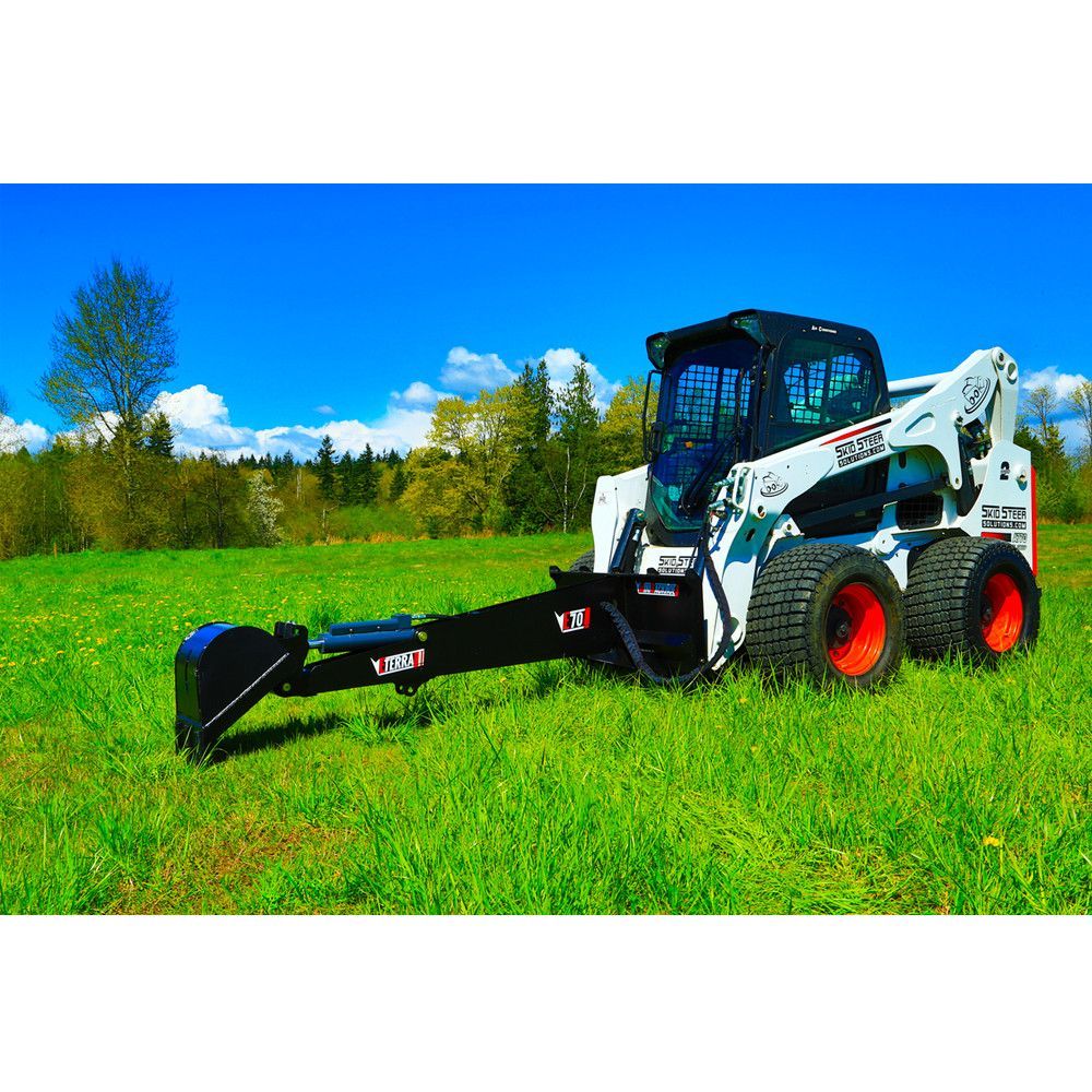 Eterra E70 skid steer backhoe attachment side view with digging boom