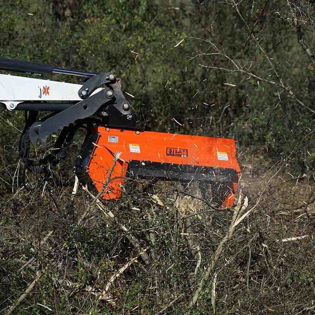 Eterra EX-40 excavator flail mower attachment front view with hydraulic motor and heavy duty cutting drum
