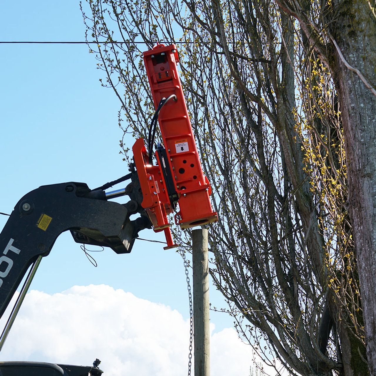 Eterra PDX-1000 skid steer hydraulic post driver attachment driving fence post along property line