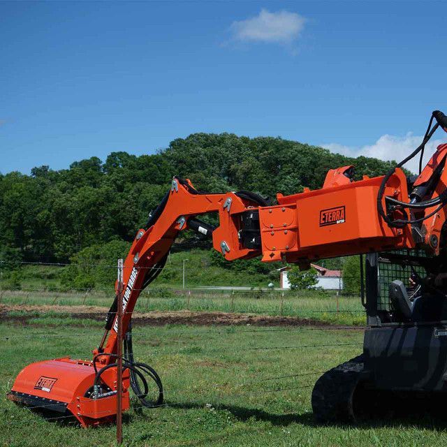 Eterra Raptor skid steer boom arm with sidewinder showing extended reach for roadside mowing and vegetation control