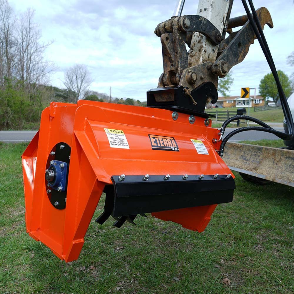 Eterra EX-30 excavator flail mower mounted on excavator showing brush cutting capability and boom arm reach