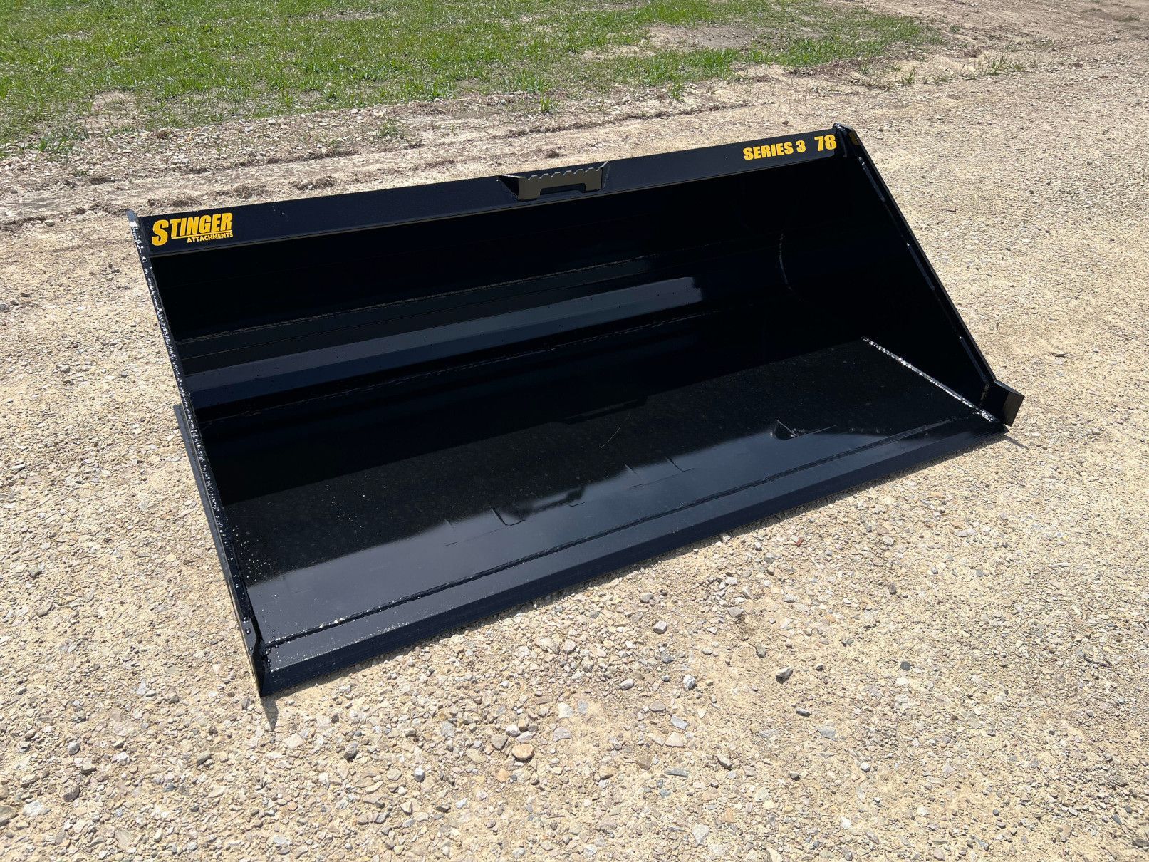 Stinger MB3 skid steer material bucket left angle view showing smooth bucket interior for material handling