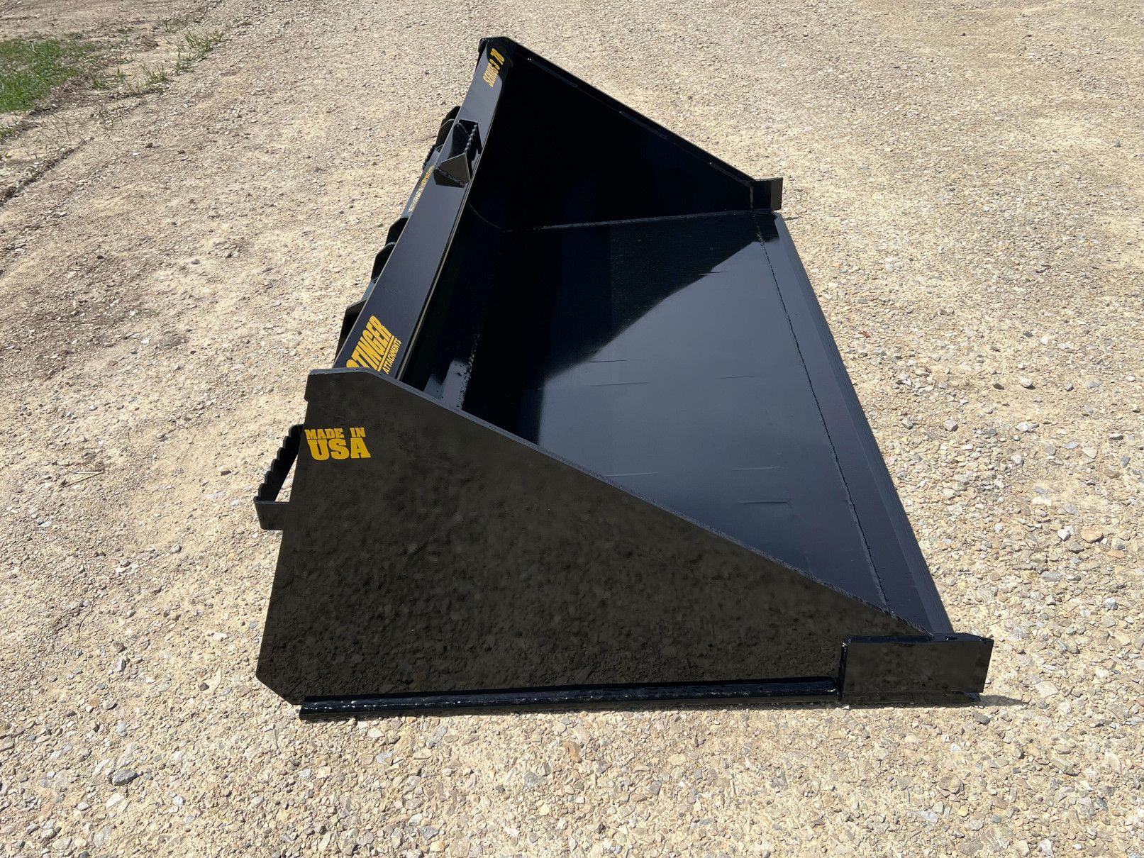 Stinger MB3 skid steer material bucket left angle view showing smooth bucket interior for material handling