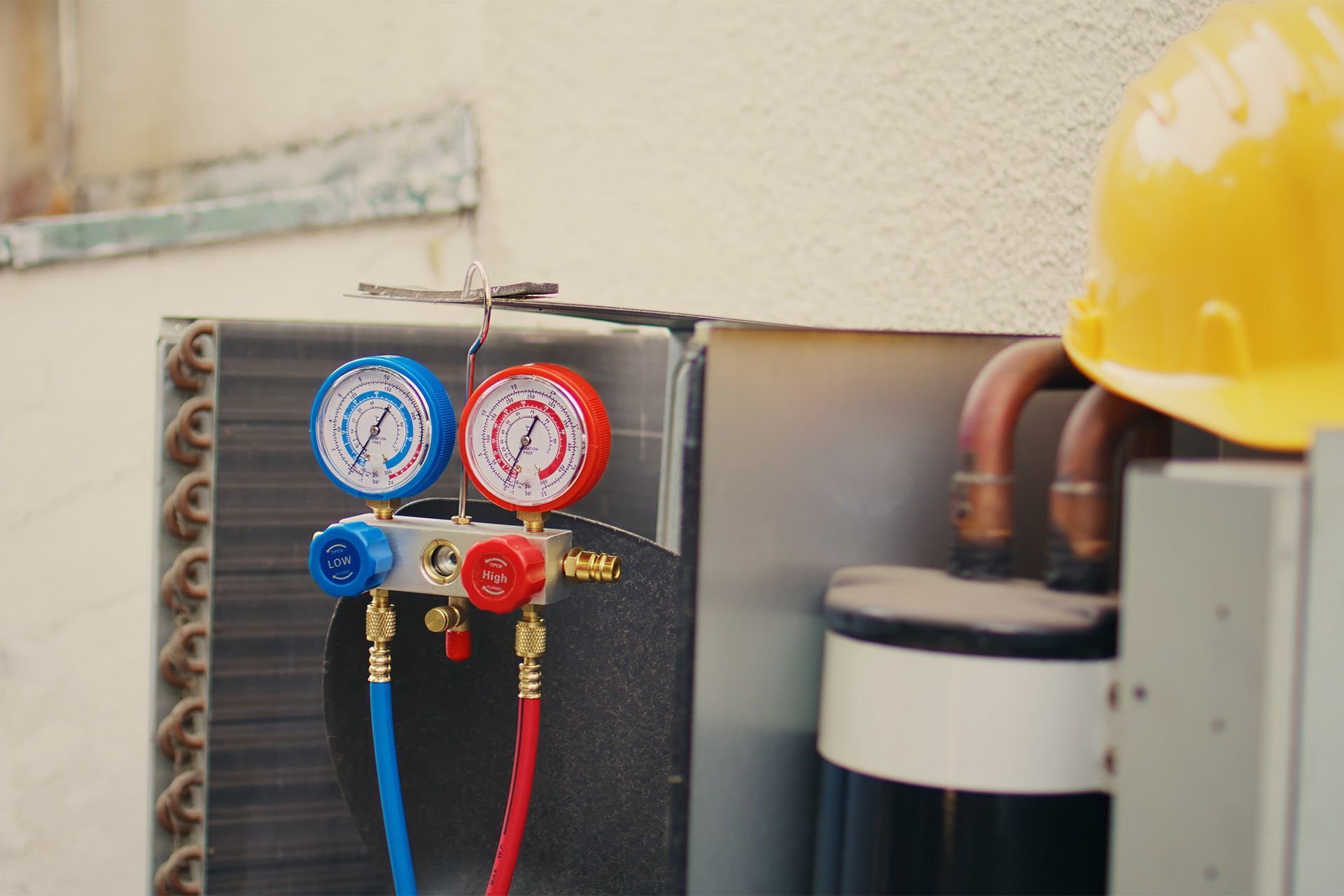 HVAC technician inspecting air conditioner for common system issues and repairs