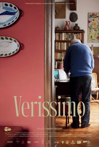 A movie poster for verissimo shows a man standing in a room