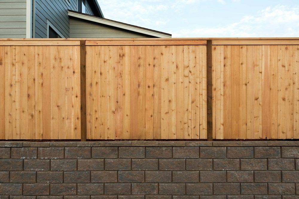 Wooden Fence Above A Retaining Wall