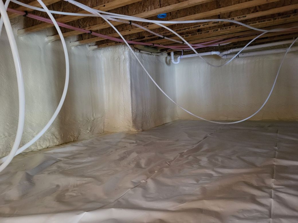 A wall with a lot of foam on it and wooden beams.