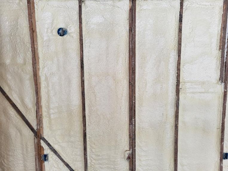 A close up of a wall with foam insulation on it.