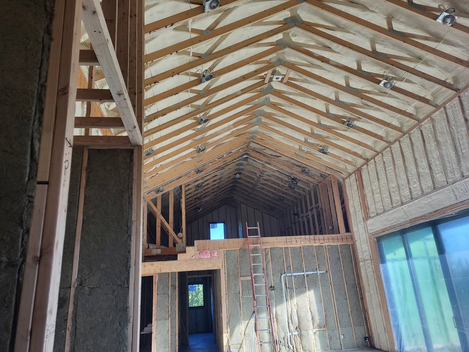 A house is being built and the ceiling is covered in insulation.