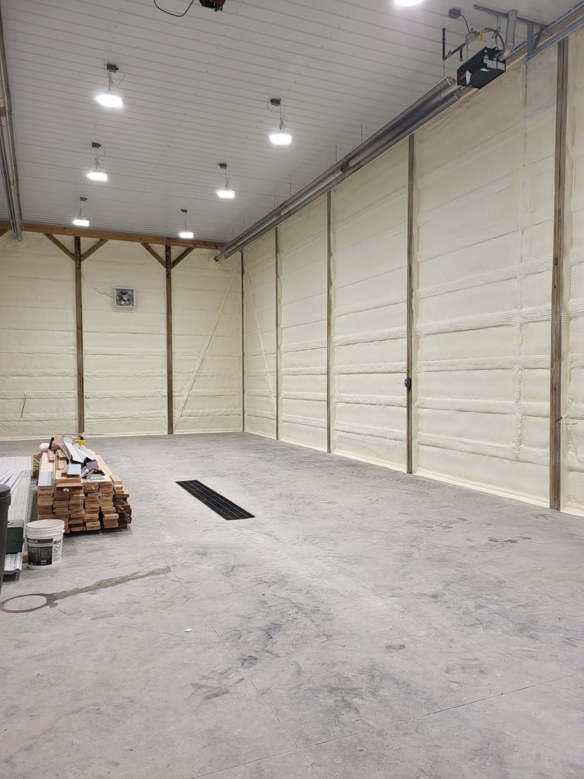 A large empty warehouse with a lot of foam on the walls.