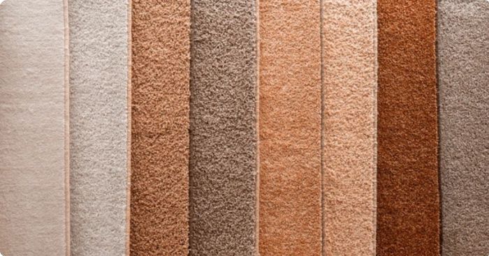 Assortment of seven rectangular carpet swatches in shades of beige, brown, and tan.