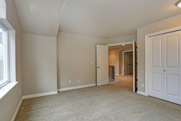 Professional carpet fitter working on installation in West Moor home